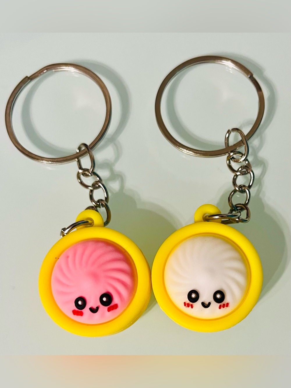 Yellow Dumpling Plush Keychain Pair with Pink & White Faces